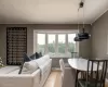 Living room featuring crown molding and light hardwood / wood-style flooring