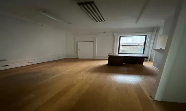 Unfurnished room featuring light wood-type flooring