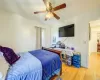 Bedroom featuring ceiling fan and light wood-type flooring