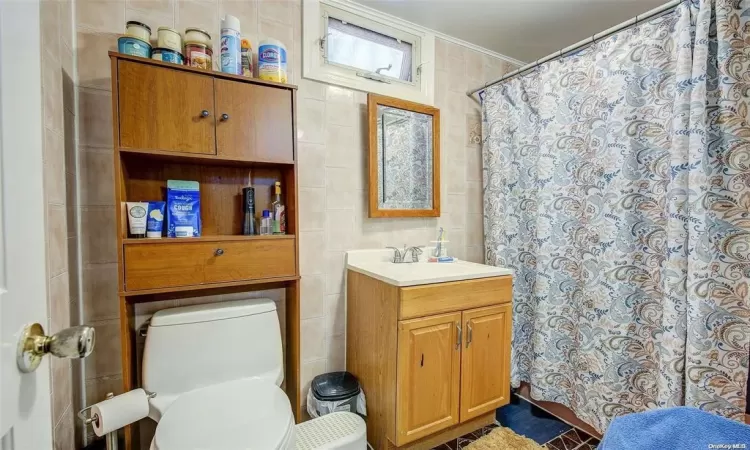 Bathroom with toilet and vanity