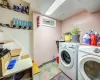 Clothes washing area with washer and clothes dryer