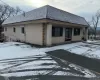 View of snow covered property