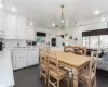 Dining area featuring dark tile patterned flooring and sink