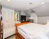 Bedroom with lofted ceiling, a closet, and light carpet