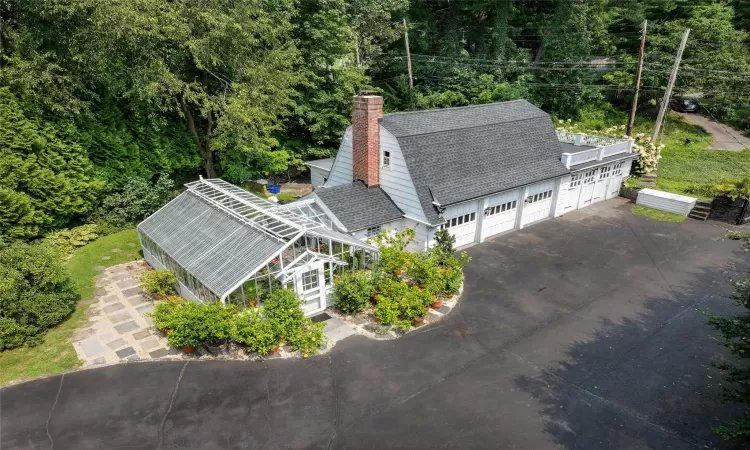 Four plus car garage with attached Lord and Burnham Greenhouse