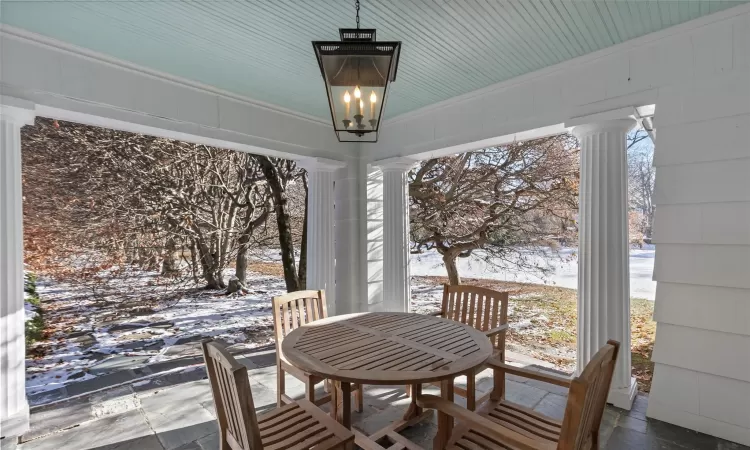 Covered Patio overlooking rear yard and gardens