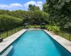 View of pool featuring a stone patio