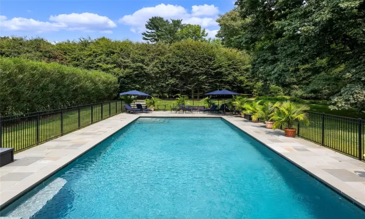 View of pool featuring a stone patio