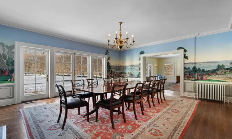 Dining Room with wall of French Doors out to patio & yard