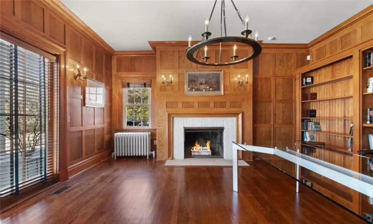 Home office with fireplace featuring plenty of natural light, French doors to terrace