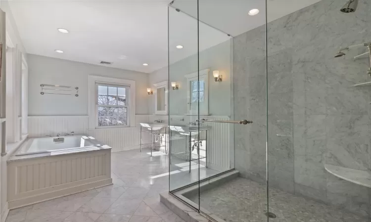 Spa like primary bath with  oversized shower and soaking tub