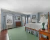 Bedroom featuring dark hardwood / wood-style flooring, crown molding