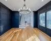 Unfurnished dining area featuring a chandelier and light hardwood / wood-style floors