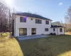 Rear view of house featuring central AC, a yard, and a patio