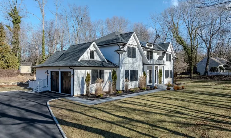 View of front of house with a front lawn