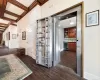 Hall with wine cooler, dark hardwood / wood-style floors, beamed ceiling, coffered ceiling, and ornamental molding