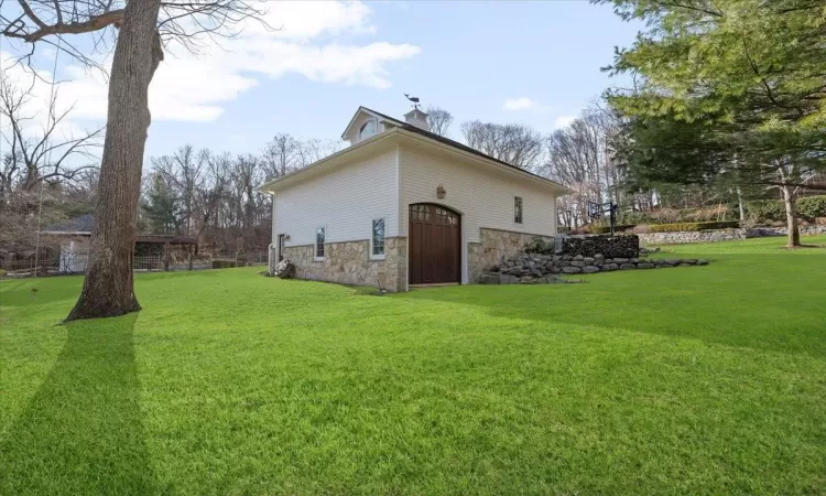 View of home's exterior featuring a lawn