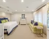 Carpeted bedroom featuring a baseboard heating unit, a closet, and crown molding