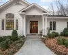 Entrance to property featuring covered porch