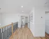 Hall featuring crown molding and light hardwood / wood-style flooring