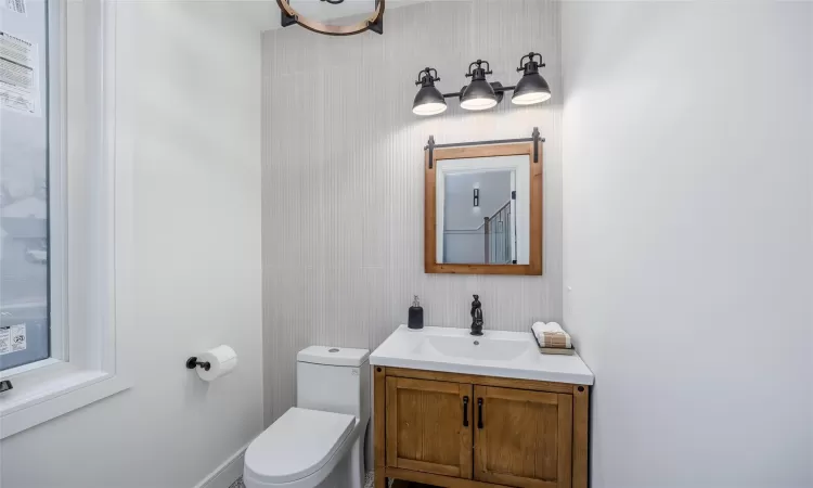 Bathroom featuring vanity and toilet