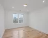 Unfurnished room featuring ornamental molding and light hardwood / wood-style floors