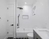 Full bathroom featuring vanity, toilet, and tiled shower / bath combo