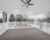 Wooden terrace featuring ceiling fan