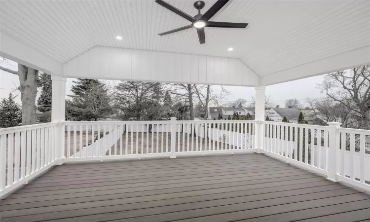 Wooden terrace featuring ceiling fan