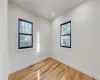 Spare room featuring hardwood / wood-style flooring