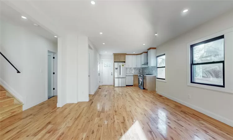 Unfurnished living room with light hardwood / wood-style flooring