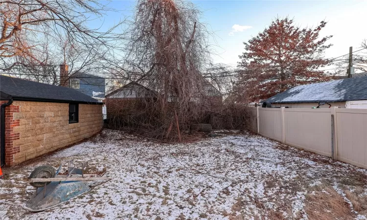 View of yard layered in snow