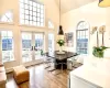 Dining space featuring high vaulted ceiling, french doors, a mountain view, and hardwood / wood-style floors