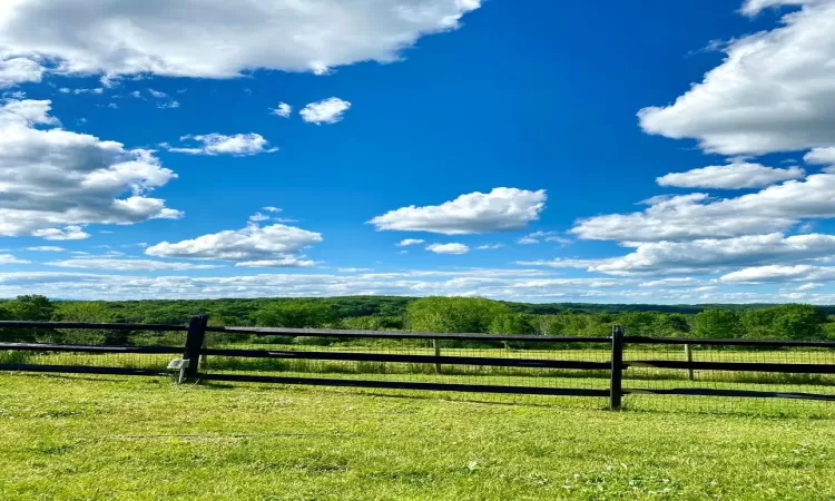 Pasture featuring a rural view