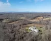 Birds eye late fall view of property with a mountain view