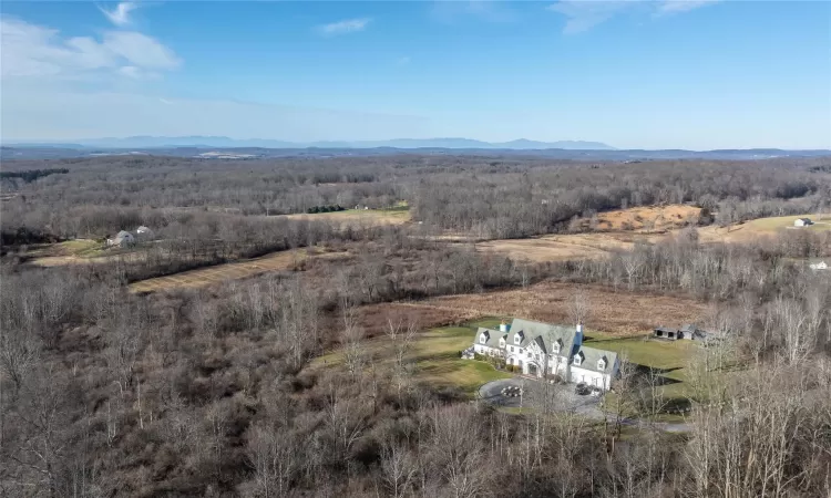 Birds eye late fall view of property with a mountain view