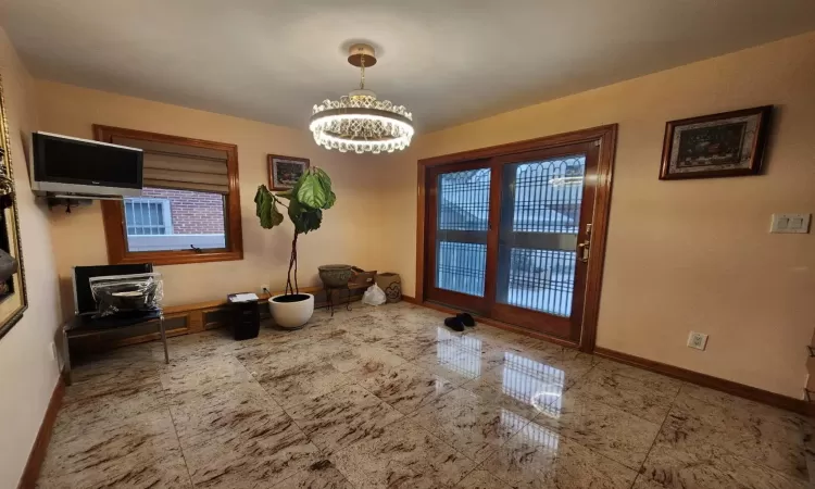 Dining area with an inviting chandelier