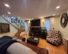 Living room with wood-type flooring and a fireplace