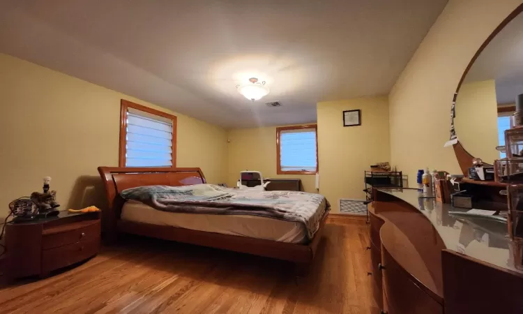 Bedroom featuring wood-type flooring