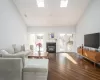 Den/family room featuring french doors, dark wood-type flooring, and a healthy amount of sunlight