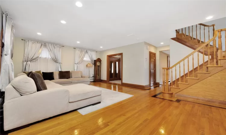 Living room with hardwood / wood-style floors