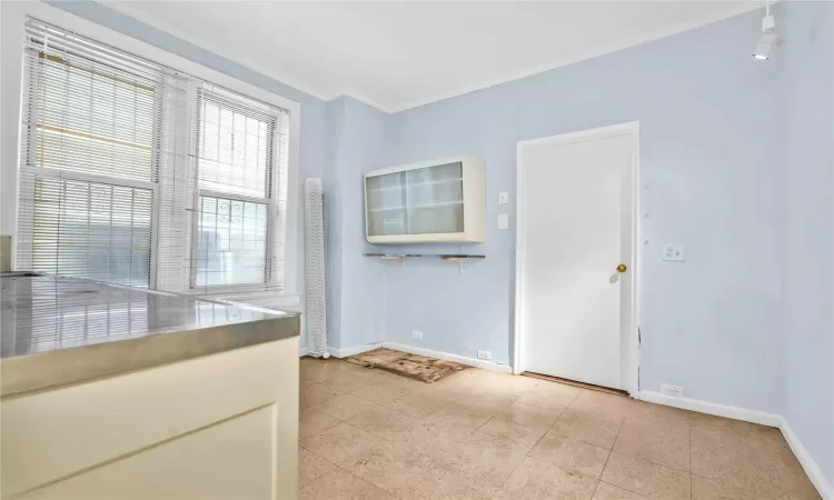 Unfurnished room with crown molding