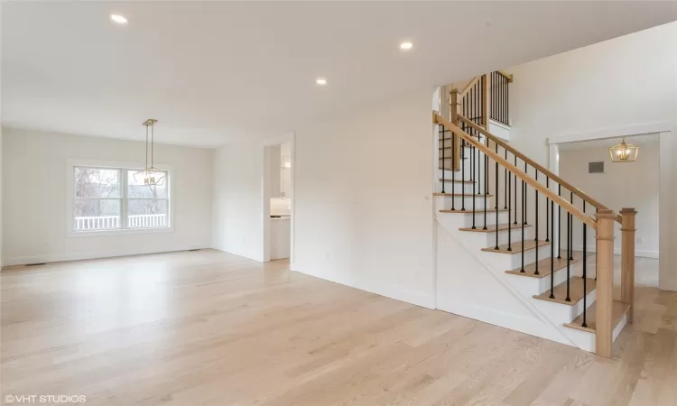 view of staircase, office, dining room and formal living room