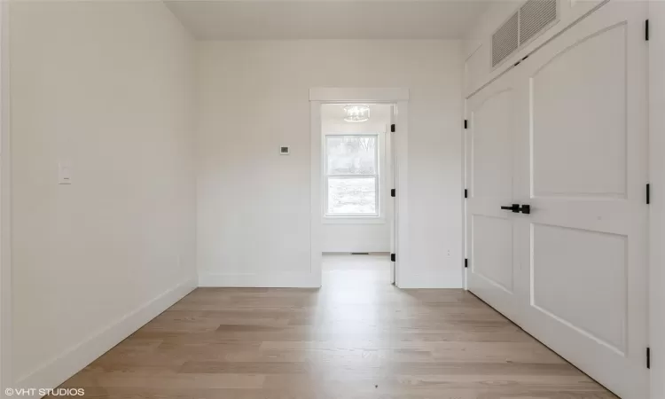 Mud room with closet, leading you to separate laundry room