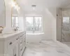 primary bathroom, soaking tub, and custom shower