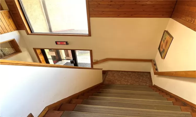 Stairs to the second floor where the office space is located.