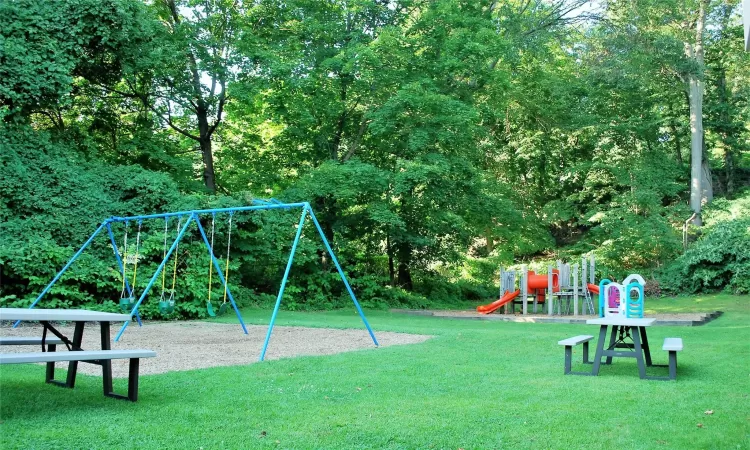 View of play area featuring a lawn