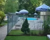 View of swimming pool with a yard