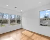 Bathroom with vanity, shower with separate bathtub, and a wealth of natural light