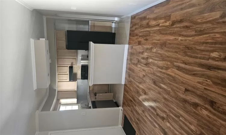 Kitchen featuring dishwasher, light brown cabinets, tasteful backsplash, ventilation hood, and refrigerator